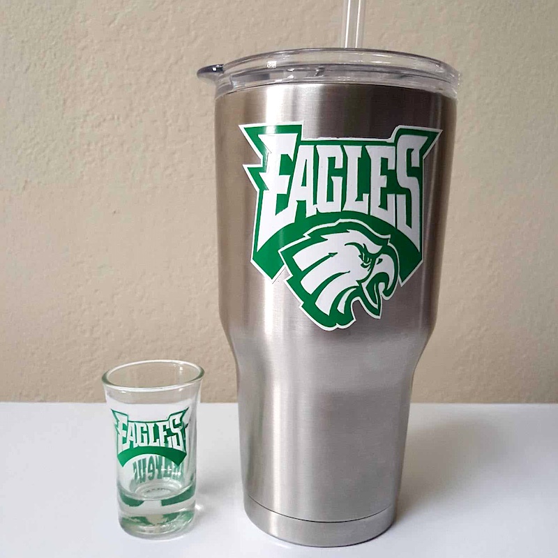 Custom laser engraved logo decal on stainless steel tumbler and shot glass